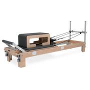 BASI Systems Pilates Reformer Sitting Box paired with reformer.