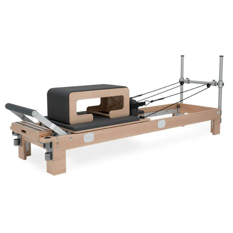 BASI Systems Pilates Reformer Sitting Box paired with reformer.