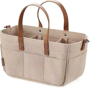 Beige Cloudscape Diaper Tote Bag made of structured felt with brown leather handles, featuring multiple internal compartments and external pockets, shown on a white background.