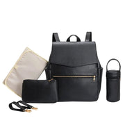 A complete black Wanderlust Essentials diaper backpack set displayed on a white background. The set includes a stylish black diaper backpack, an insulated bottle holder, a small zippered pouch, a foldable changing mat, and two stroller attachment straps.