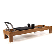 Peak Pilates Artistry Reformer with Leather side view of the frame