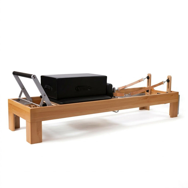 Peak Pilates Artistry Reformer with Leather three quarter view with box